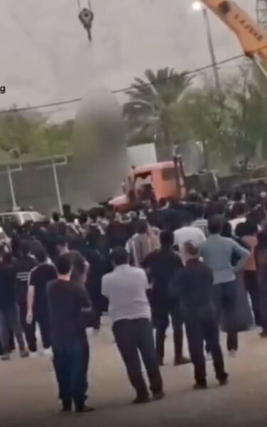 Moment ‘k!ller’ is publicly hanged from a crane in front of a cheering crowd