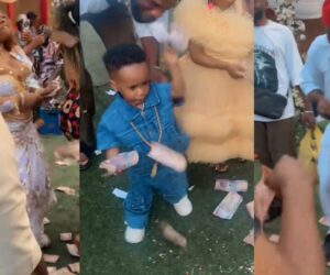 Mum shares playful naira note-spraying challenge between her husband and little son at a wedding ceremony.