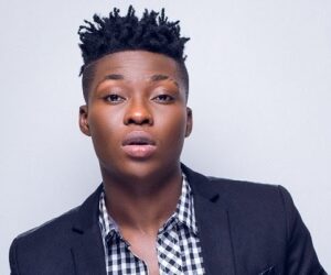 Reekado Banks tackles critic who called him a ‘failed artiste’ for going to church