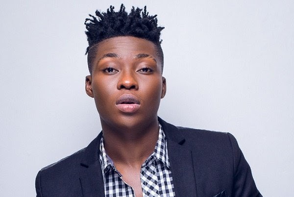 Reekado Banks tackles critic who called him a ‘failed artiste’ for going to church