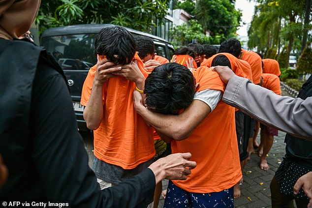 Dozens of men arrested and paraded by police for holding ‘g@y s£x party’ in Indonesia