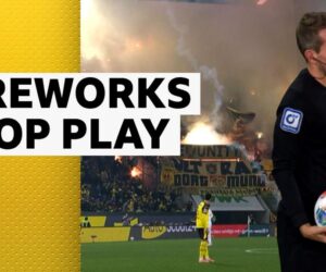 Augsburg v Dortmund halted after fireworks land on pitch