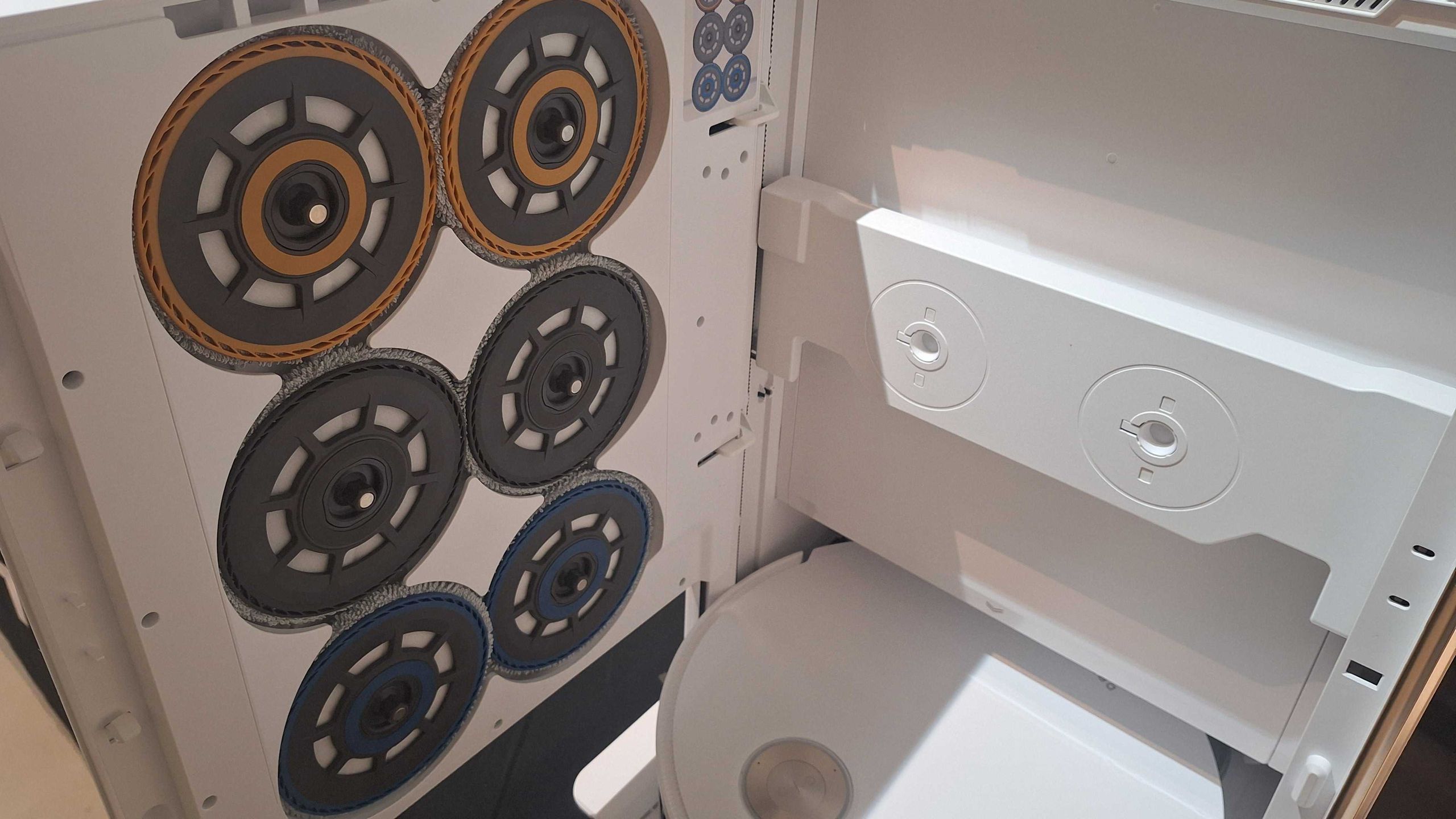 I’m equal parts impressed and intimidated by this new robovac’s vending machine-style mopping setup