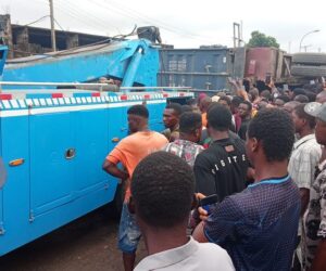 3 k!lled, others trapped as container-laden truck falls on tricycles in Onitsha