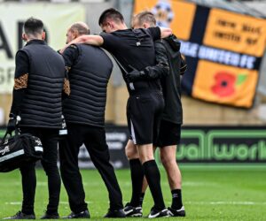 Football match suspended after referee collapsed