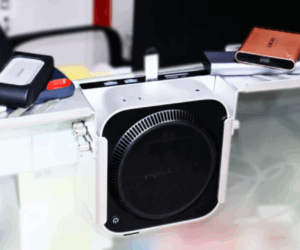 This Mac mini “exoskeleton” flips the script by hiding your computer behind the desk instead of showing it off
