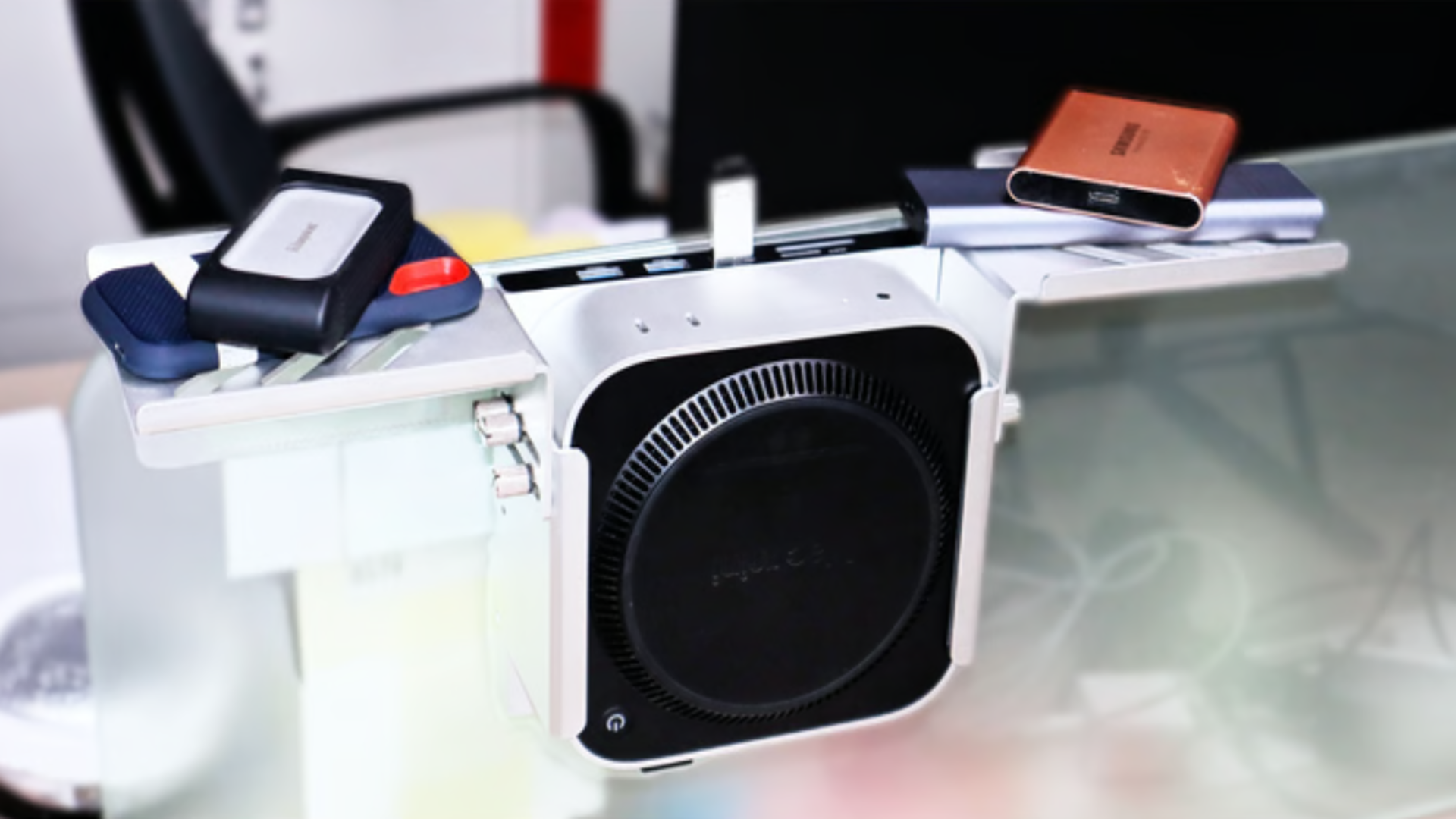 This Mac mini “exoskeleton” flips the script by hiding your computer behind the desk instead of showing it off