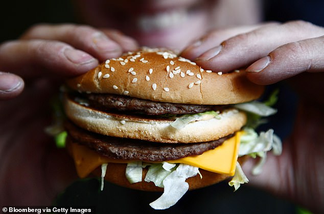 Man, 22, fights for life after swallowing a whole burger without chewing it