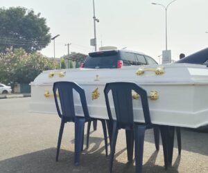 PHOTOS: Contractors Lay Coffin In Front Of Finance Ministry