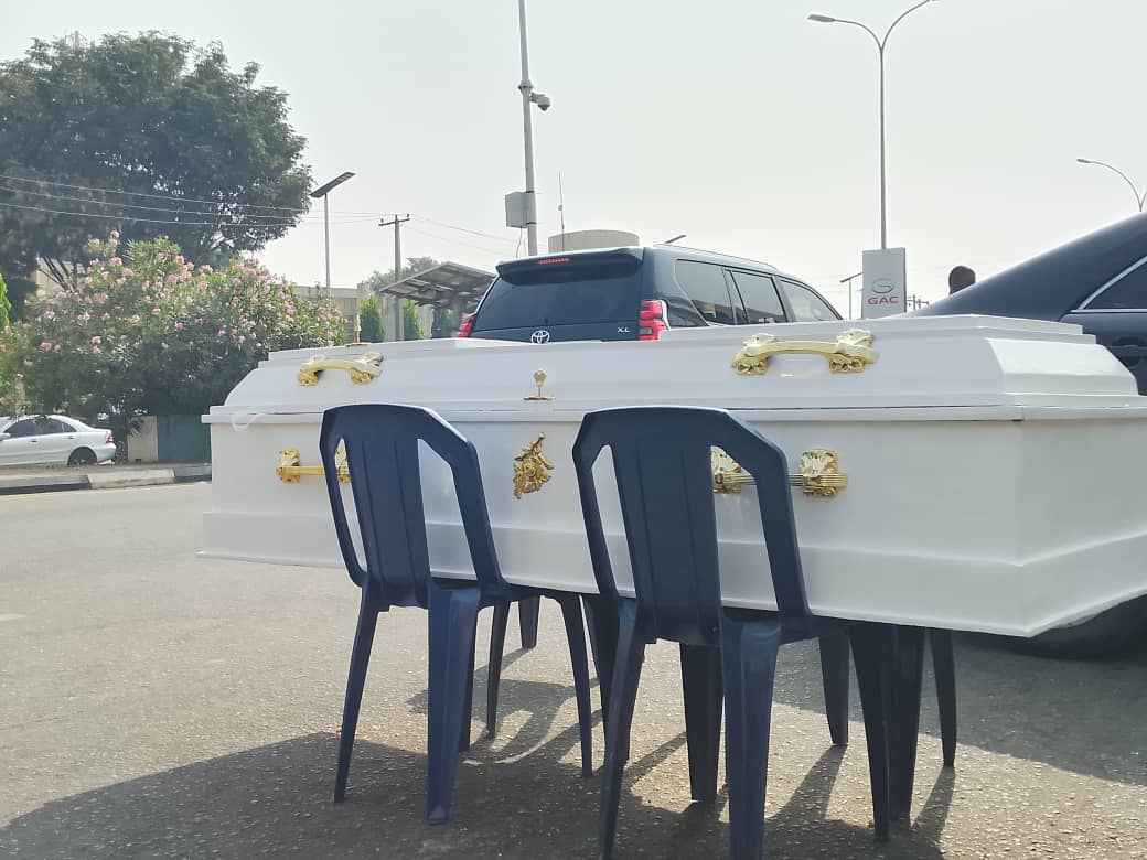 PHOTOS: Contractors Lay Coffin In Front Of Finance Ministry