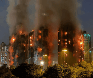 Hong Kong arrests 13 as probe into deadly estate fire widens