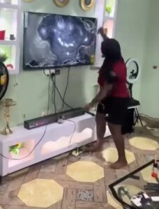 Angry girlfriend uses knife to destroy her boyfriend's TV after another woman called...